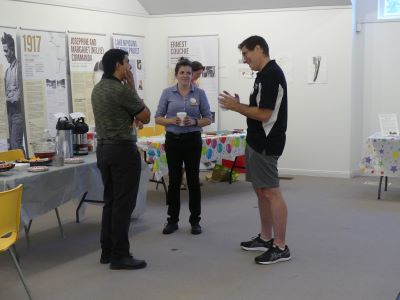 people talking in art gallery